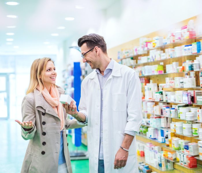 male-pharmacist-serving-a-female-customer-.jpg