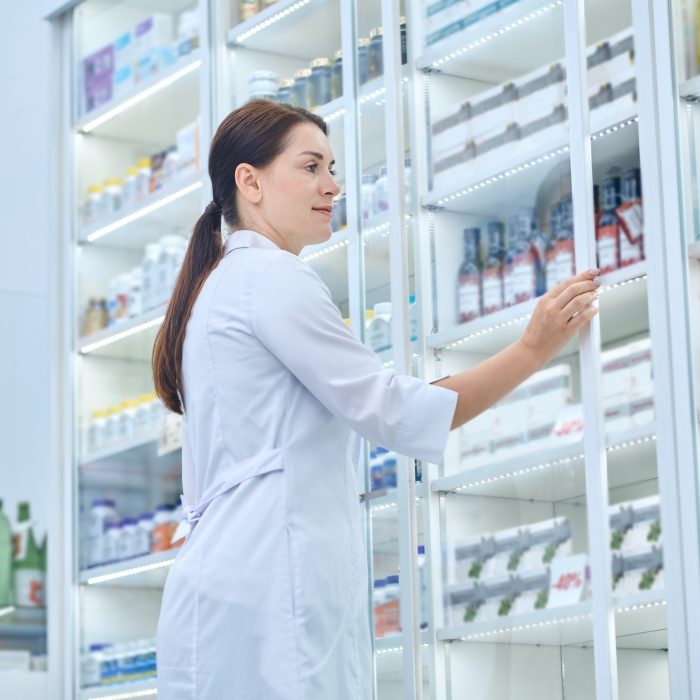 Pharmacist checking medicines in a drugstore